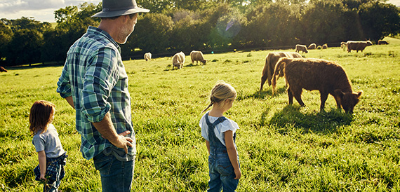 Father and kids on a cattle ranch