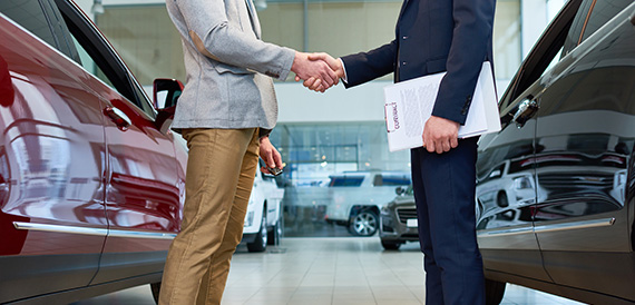 Man buying a new car